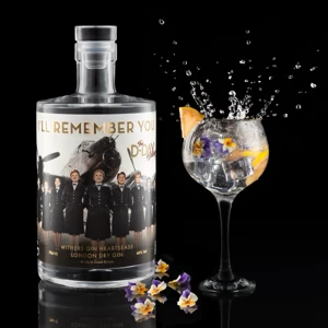 A bottle of Withers I'll Remember You Gin stands surrounded by a dramatic splash of water against a dark background.