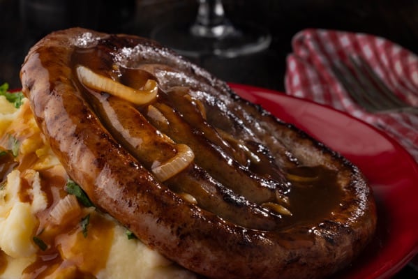 Rustic, traditional sausage with buttery mash and onion gravy.