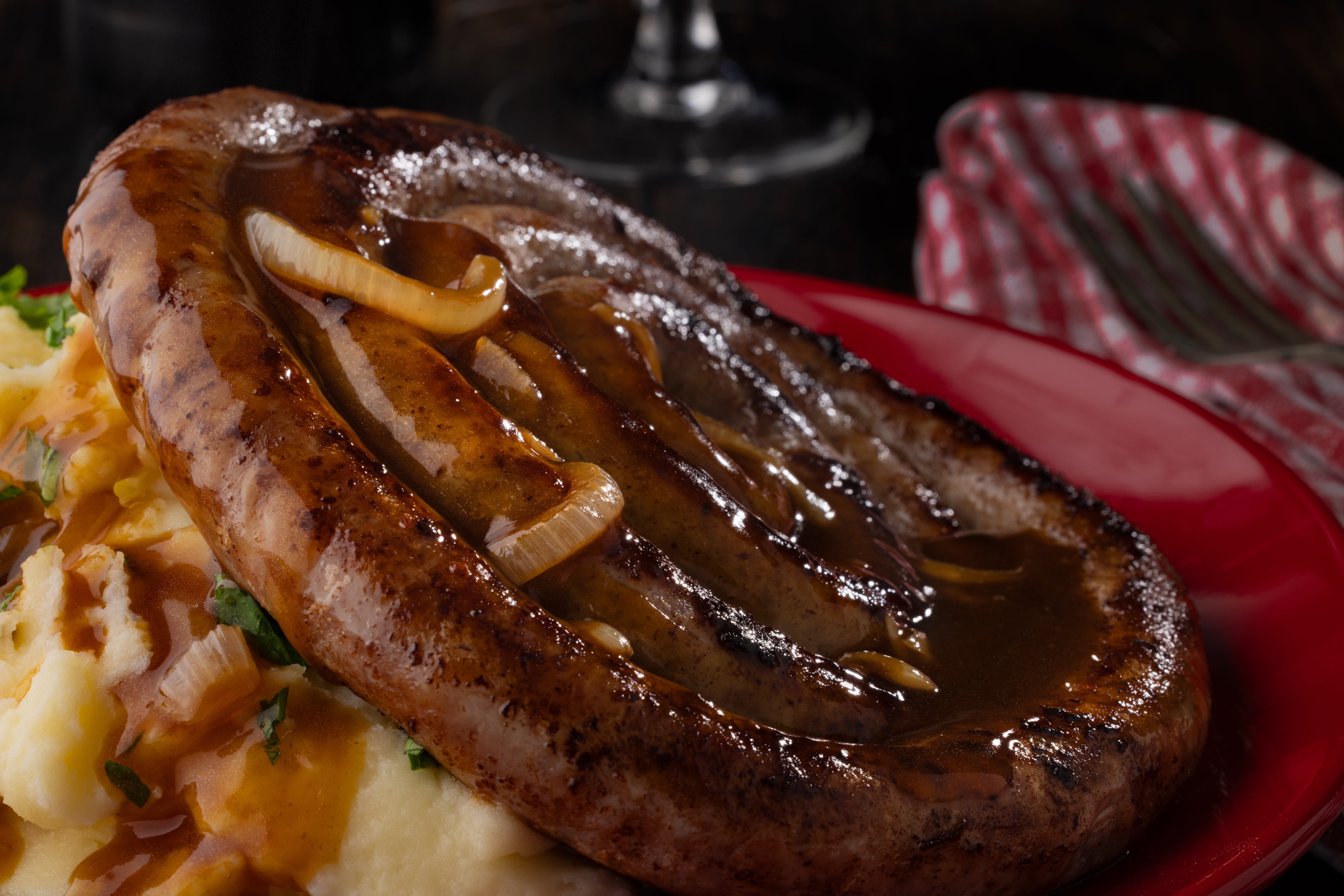 Rustic, traditional sausage with delicious buttery mash and onion gravy. Styled and photographed by JaxMore Food and Drink Photography, in their Derby studio.