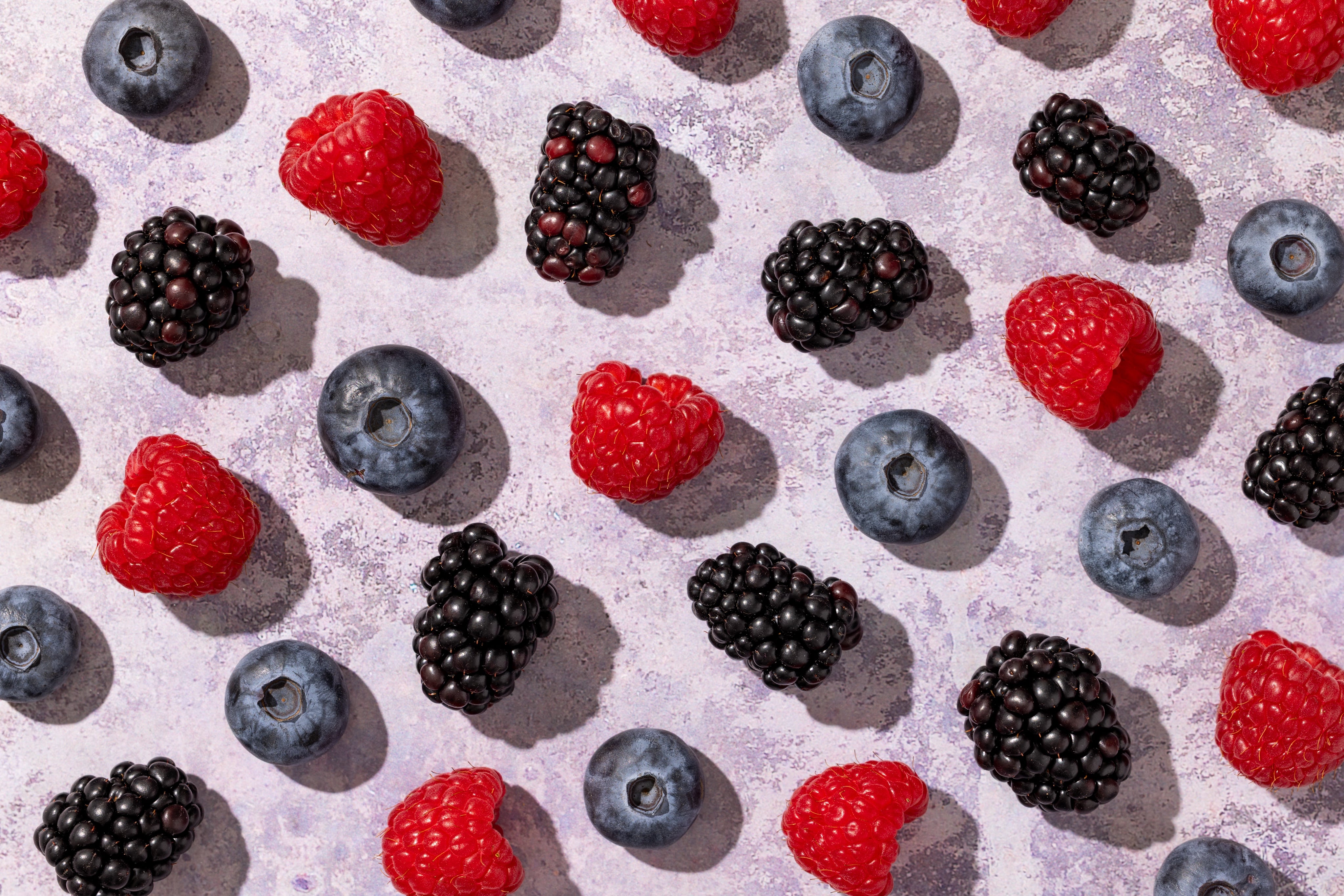 Juicy, sunny and totally delicious. A creative flat lay of berries, styled and photographed by JaxMore Food and Drink Photography, in their Derby studio.