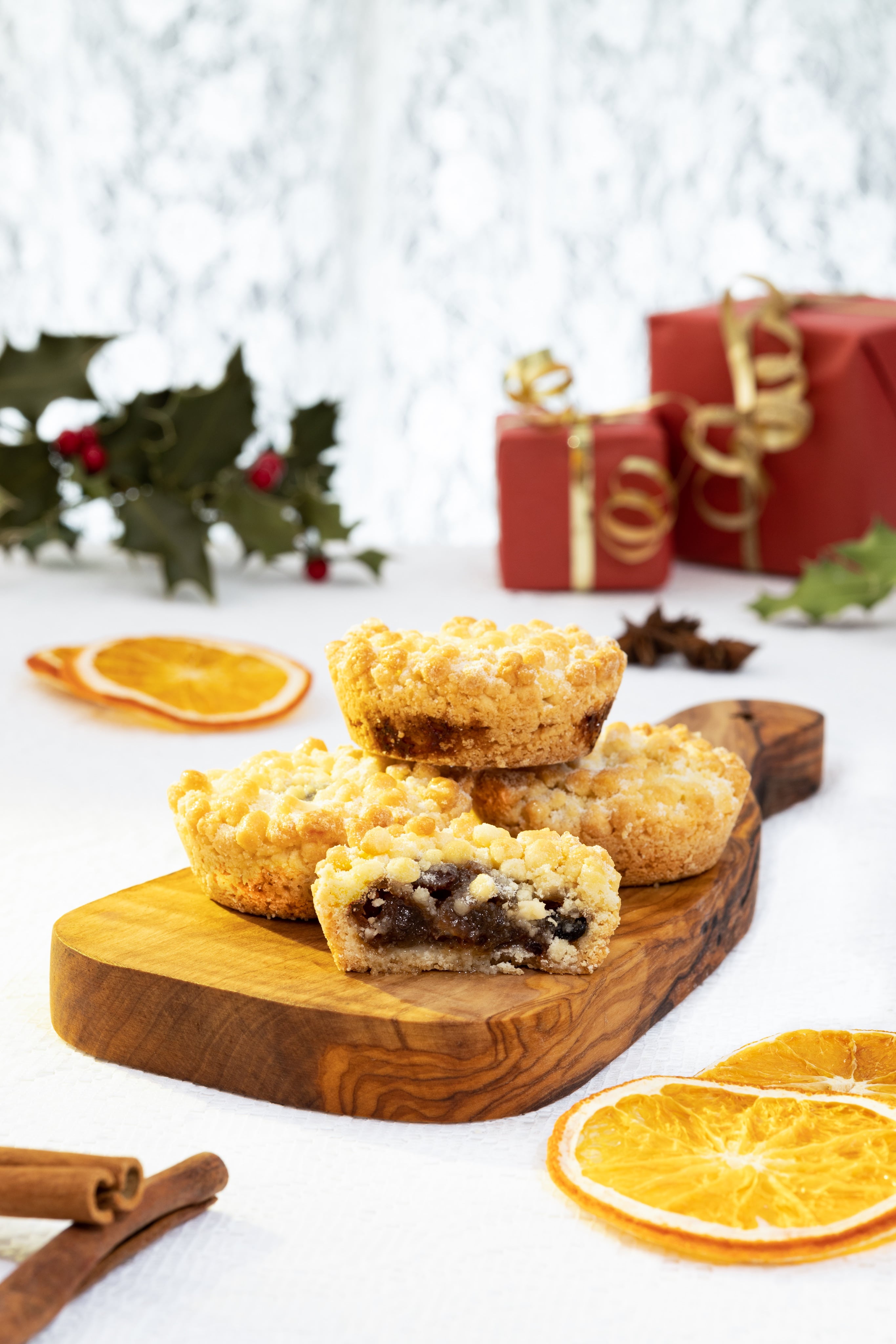 Creative photograph of delicious mince pies in a Christmas setting. By JaxMore Food and Drink Photography, shot in their Derby studio.