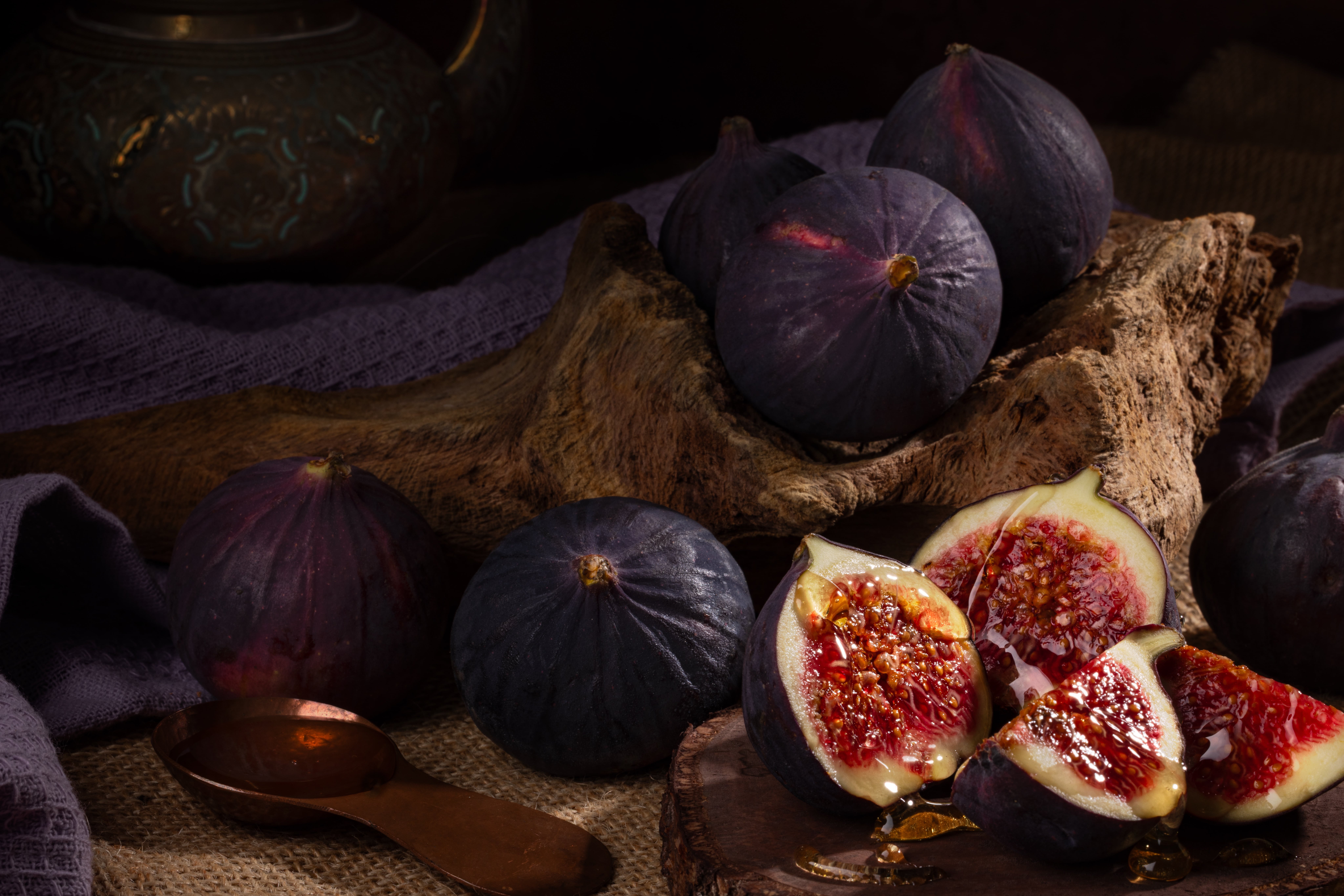 A fresh fig harvest, drizzles with honey. Photographed by JaxMore Food and Drink Photography, in their Derby studio.