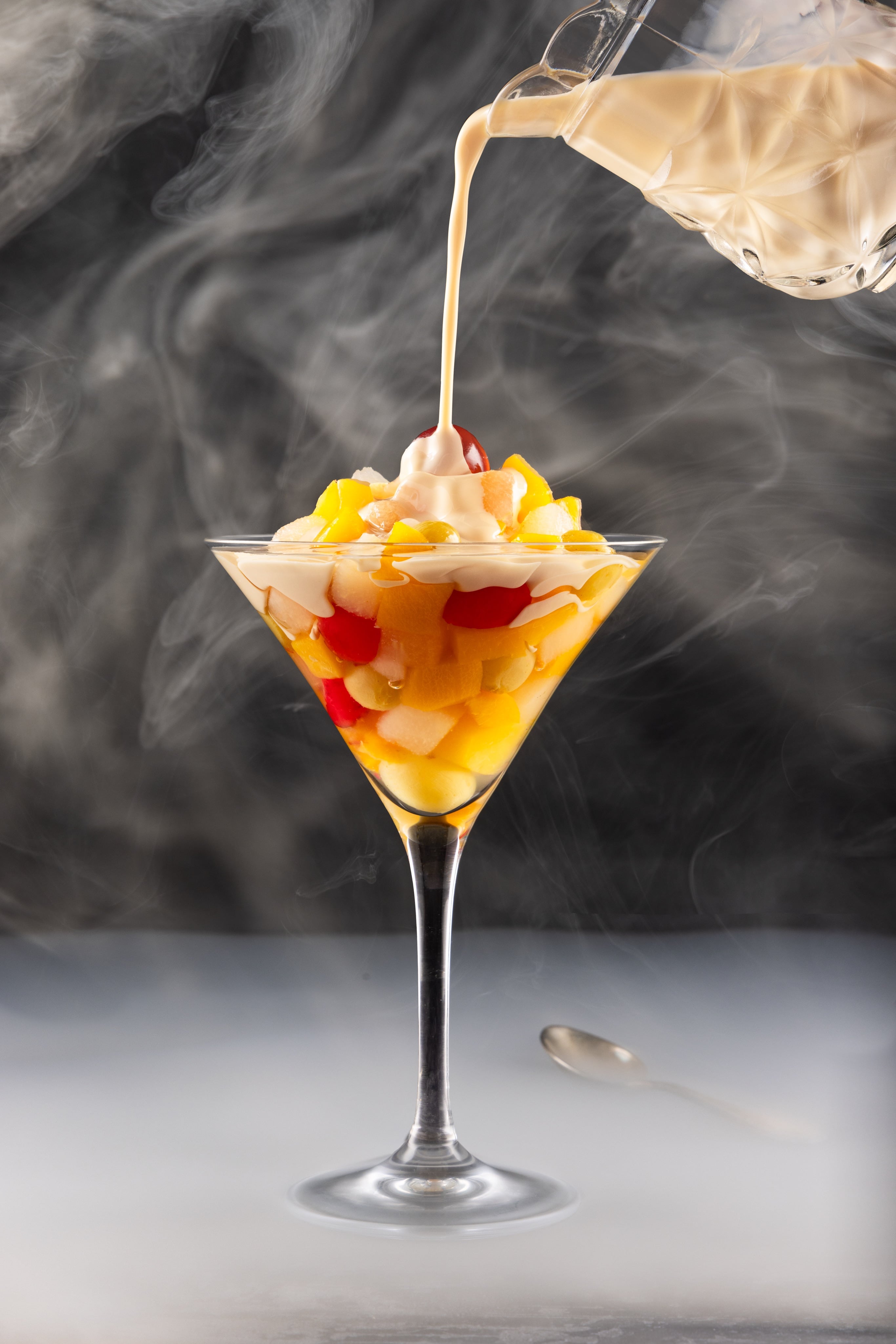 A part of JaxMore Food and Drink Photography's Elevated Retro Food Series. Tinned fruit cocktail and evaporated milk, shot to look like gourmet food.