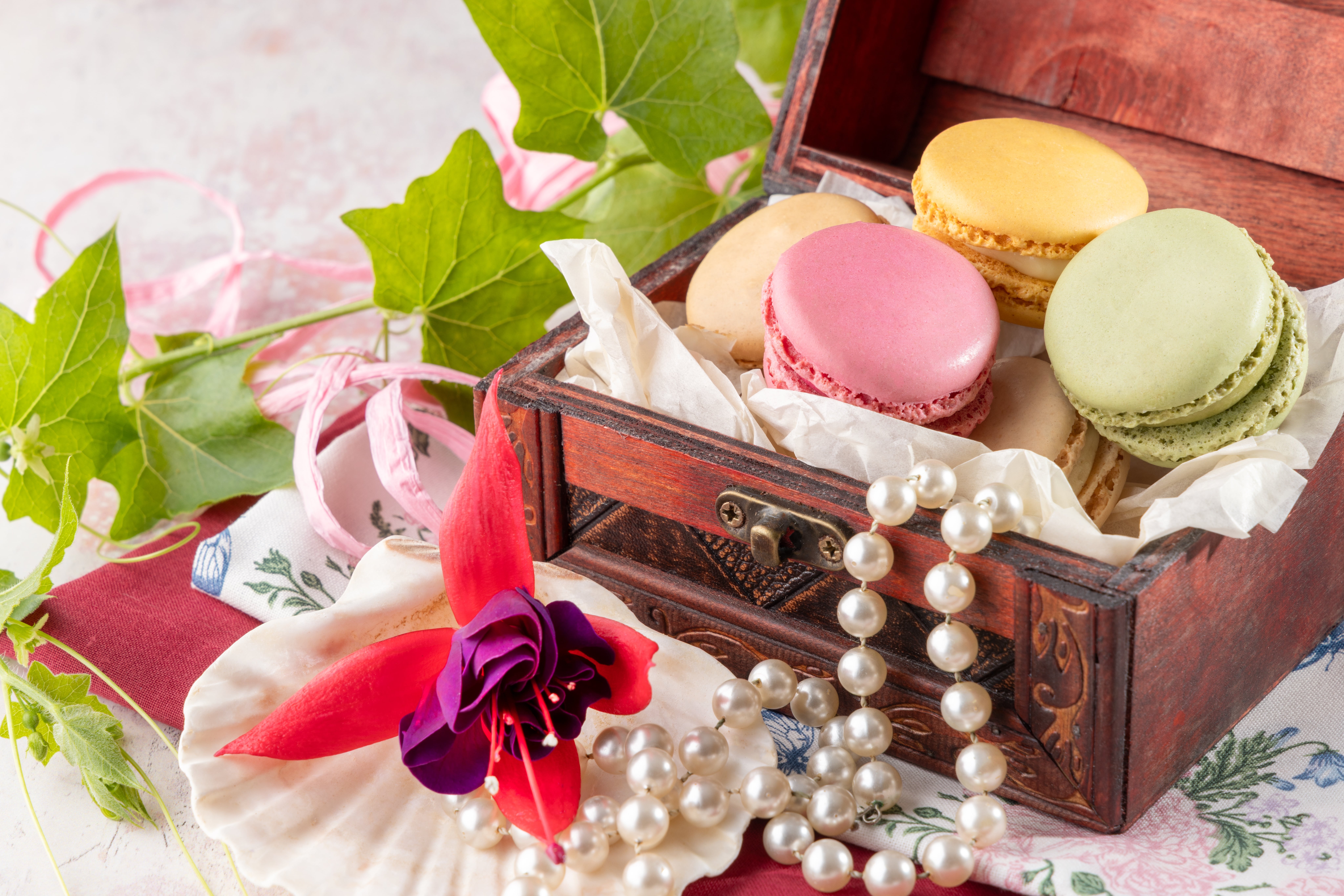 A chest of delicate macarons, in all their decadence. Photographed by JaxMore Food and Drink Photography, in their Derby studio.