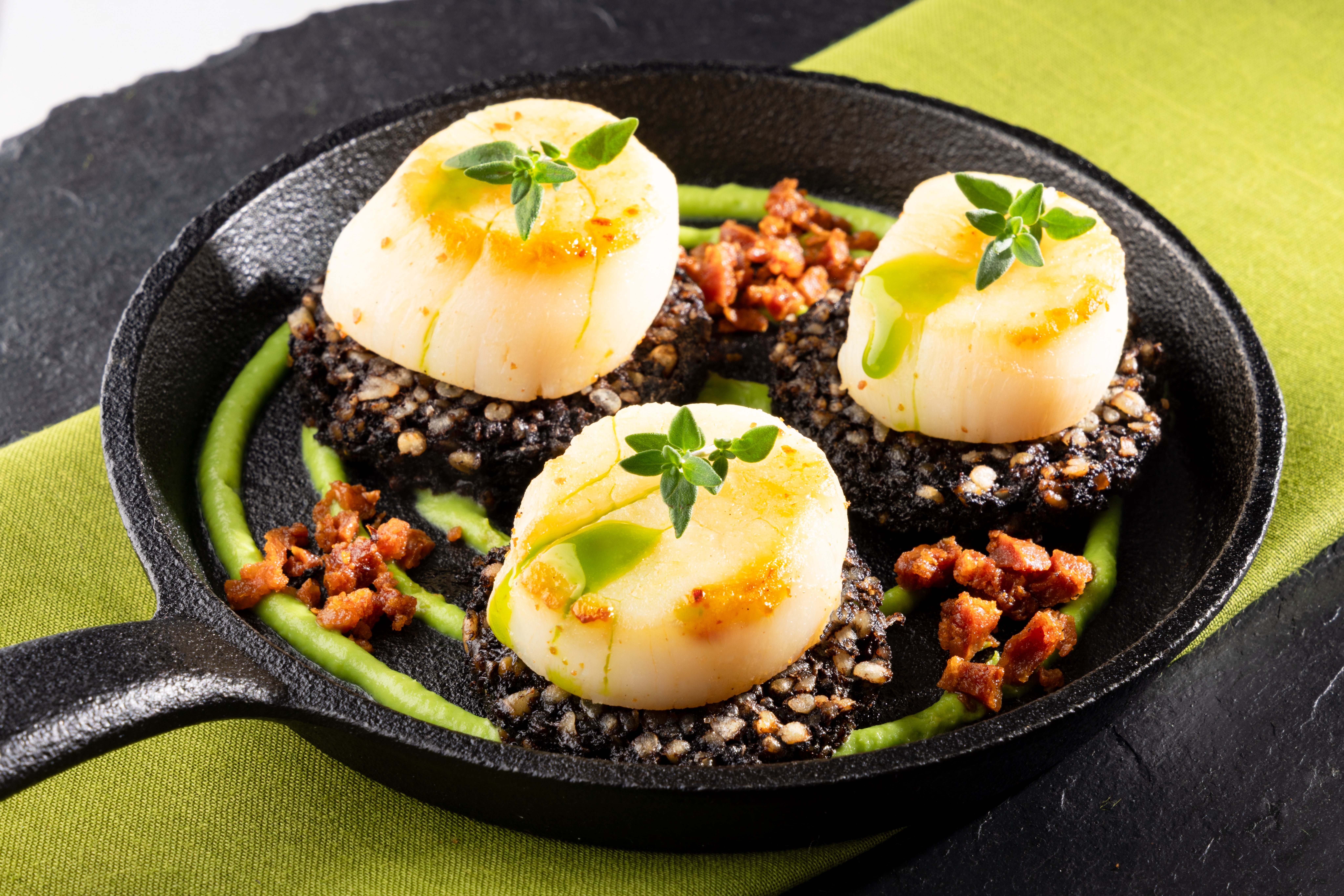 Seared Scallops, Black Pudding, Pea Purée and a Chorizo Crumb, styled and photographed by JaxMore Food and Drink Photography, in their Derby studio.