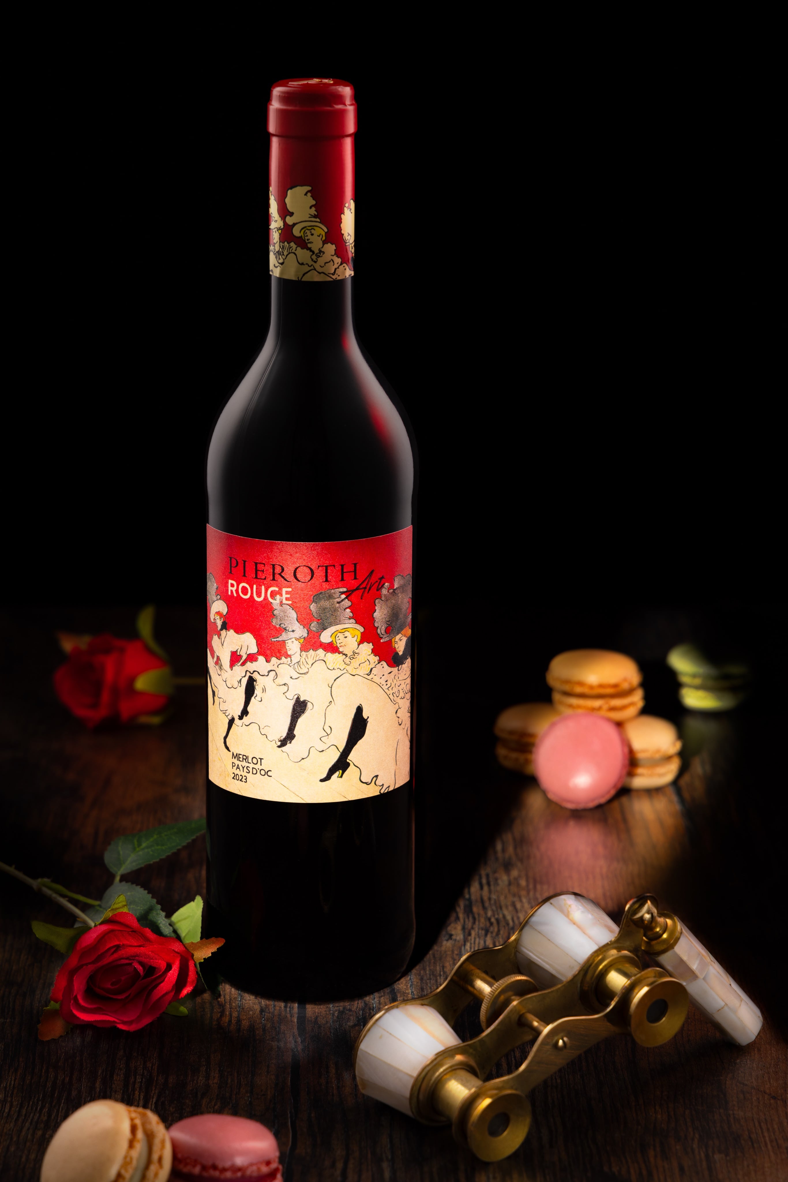 Creative photograph of Pieroth Rouge Wine, Moulin Rouge style, with opera glasses and Macarons. By JaxMore Food and Drink Photography, in their Derby studio.