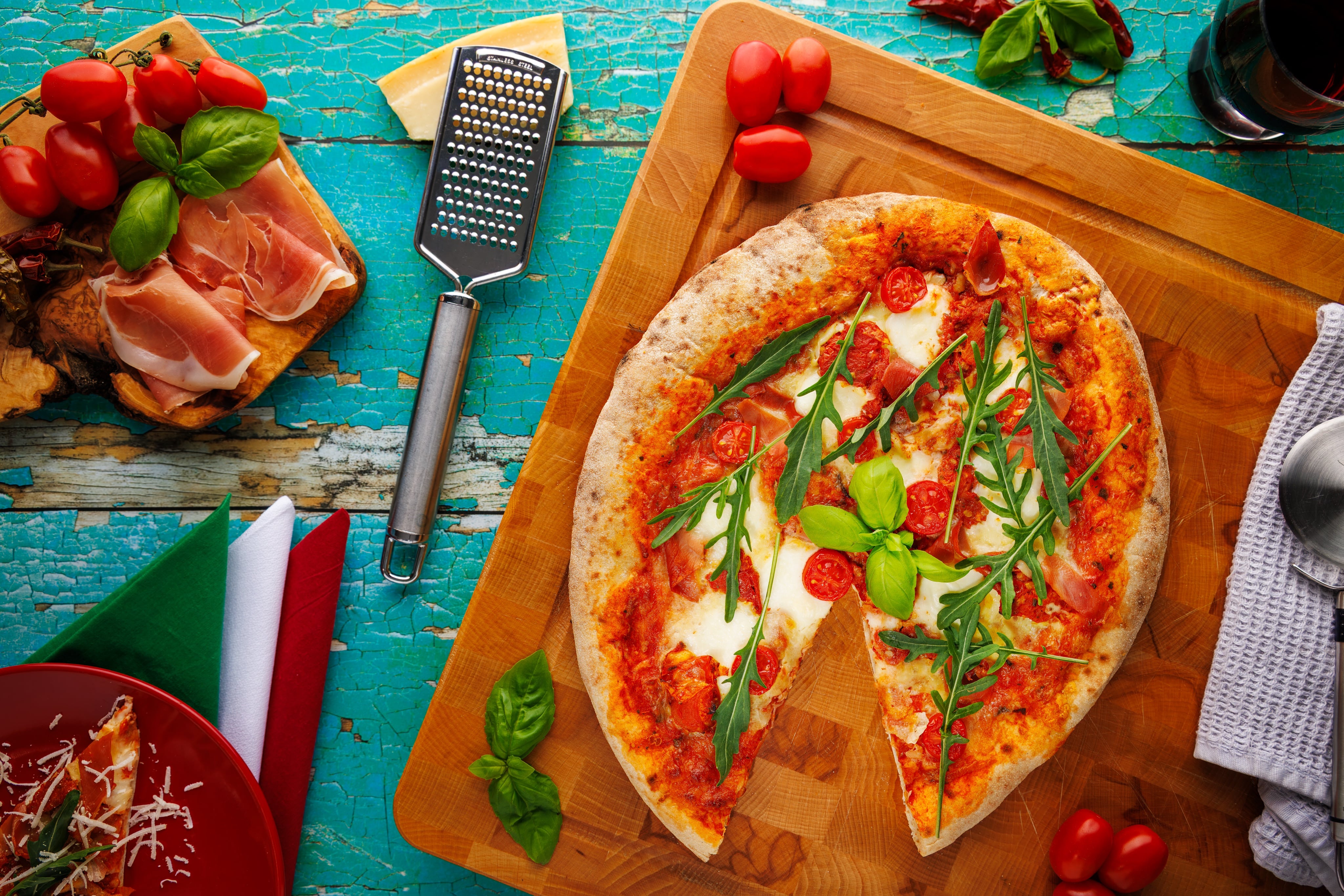An authentic Italian pizza, shot as a flat lay by JaxMore Food and Drink Photography. Features the fresh ingredients for premium impact.