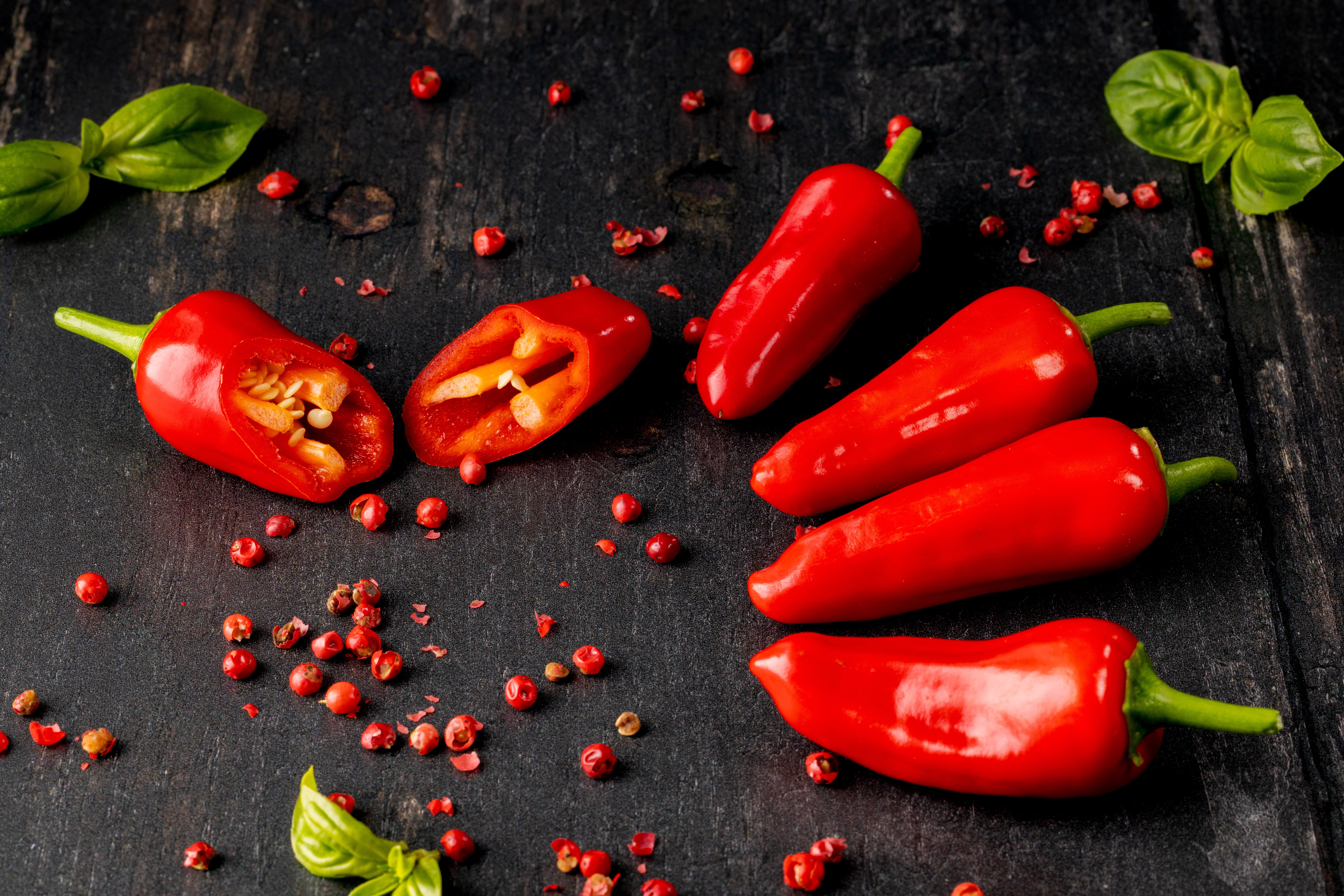 Freshly harvested Chilles with Basil and Red Peppercorns. Photographed by JaxMore Food and Drink Photography, in their Derby studio.