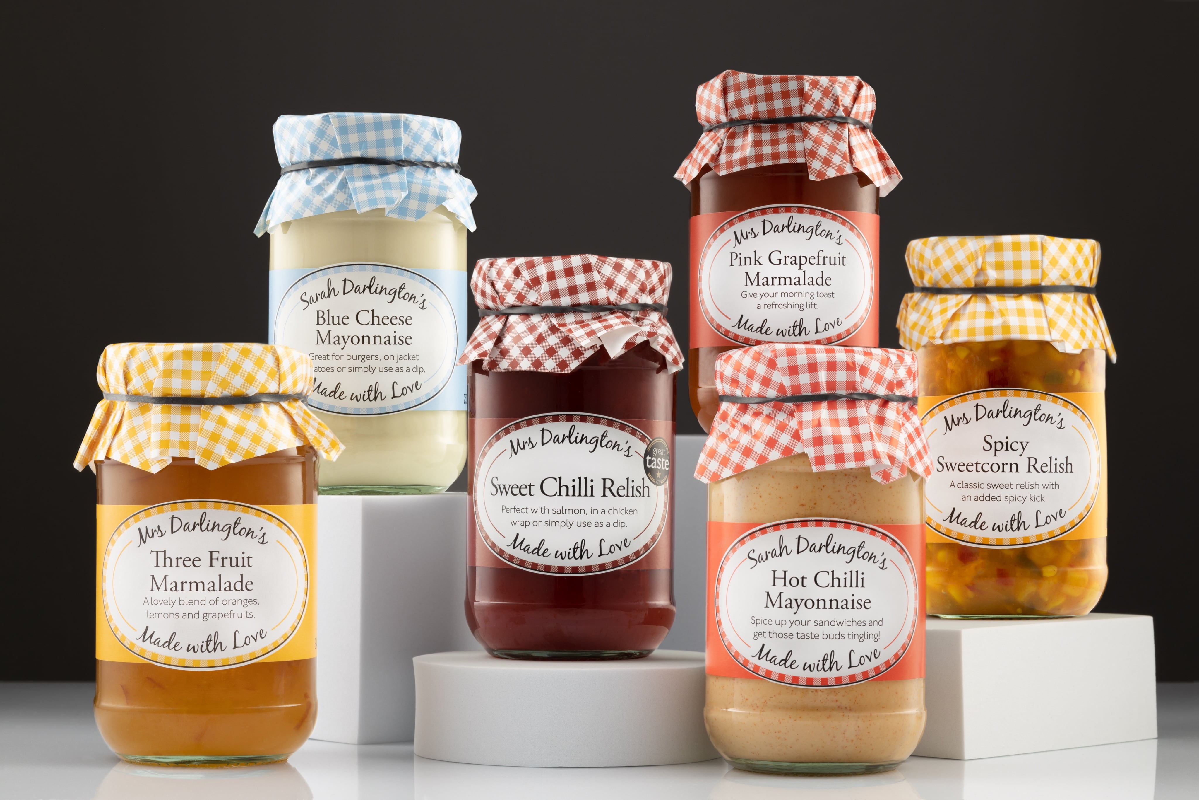 Creative, dramatic photograph of a selection of Mrs Darlington's Relish and Jam Jars. Shot by JaxMore Food and Drink Photography, in their Derby studio.
