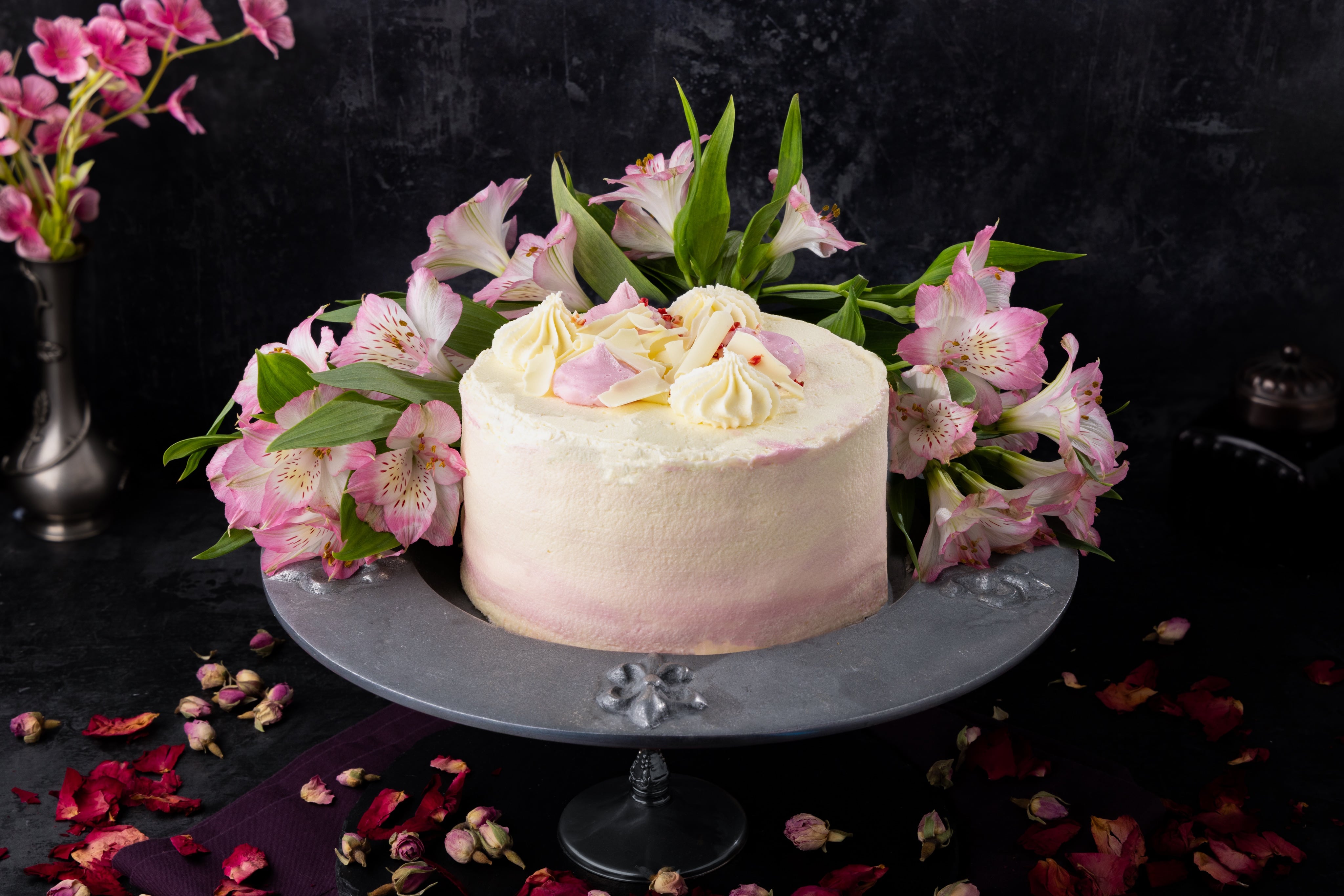 Sophisticated Strawberry Madeira Cake, shot in a opulent, dramatic dark and moody style. Photographed by JaxMore Food and Drink Photography, in their Derby studio.