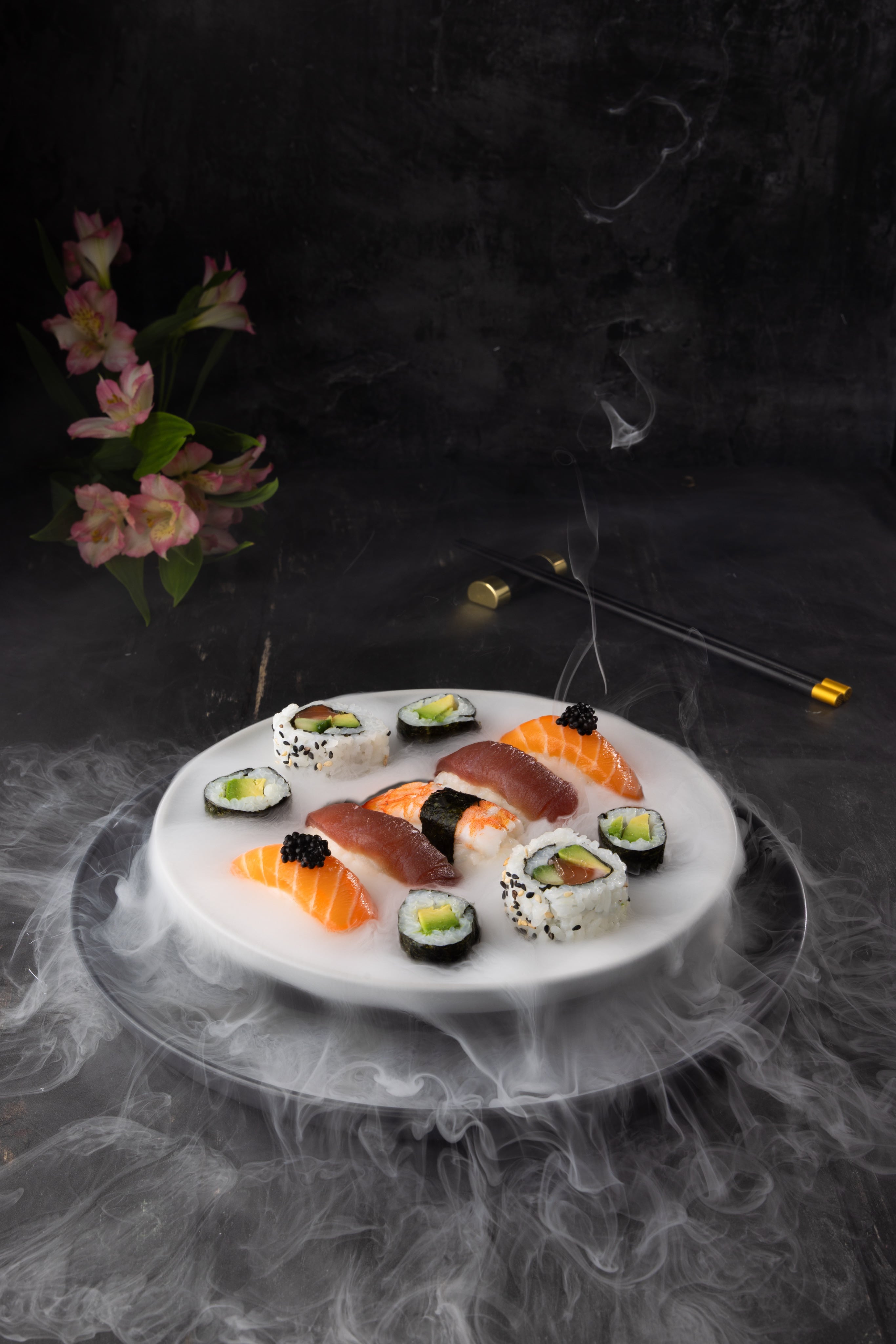 Elegant sushi platter, styled and photographed by JaxMore Food and Drink Photography. The dry ice adds really drama and impact to this scroll-stopping professional photograph.
