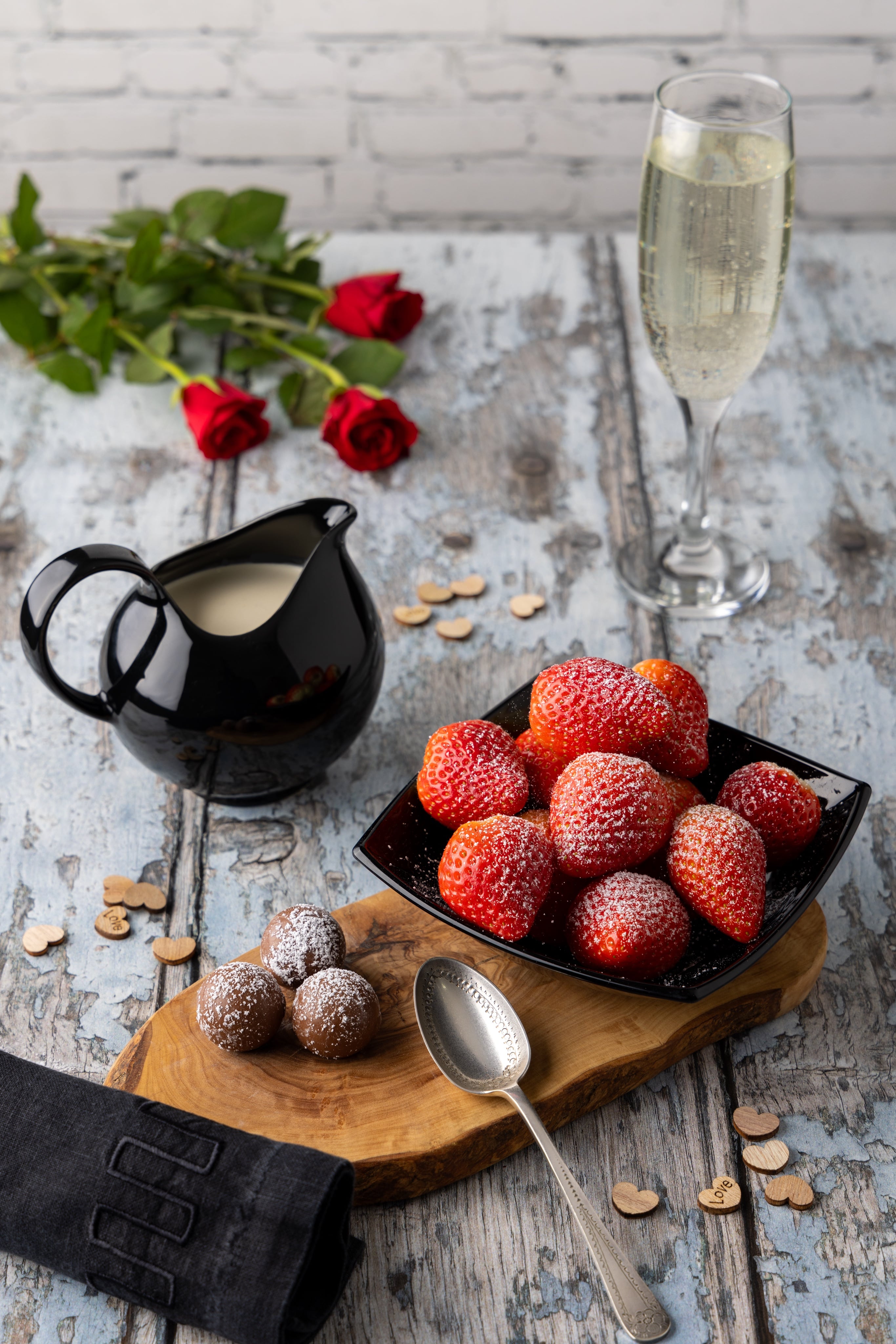 A decadent Valentine's Day Dessert, with strawberries, cream and chocolates.  Photograph by JaxMore Food and Drink Photography, shot in their Derby studio.