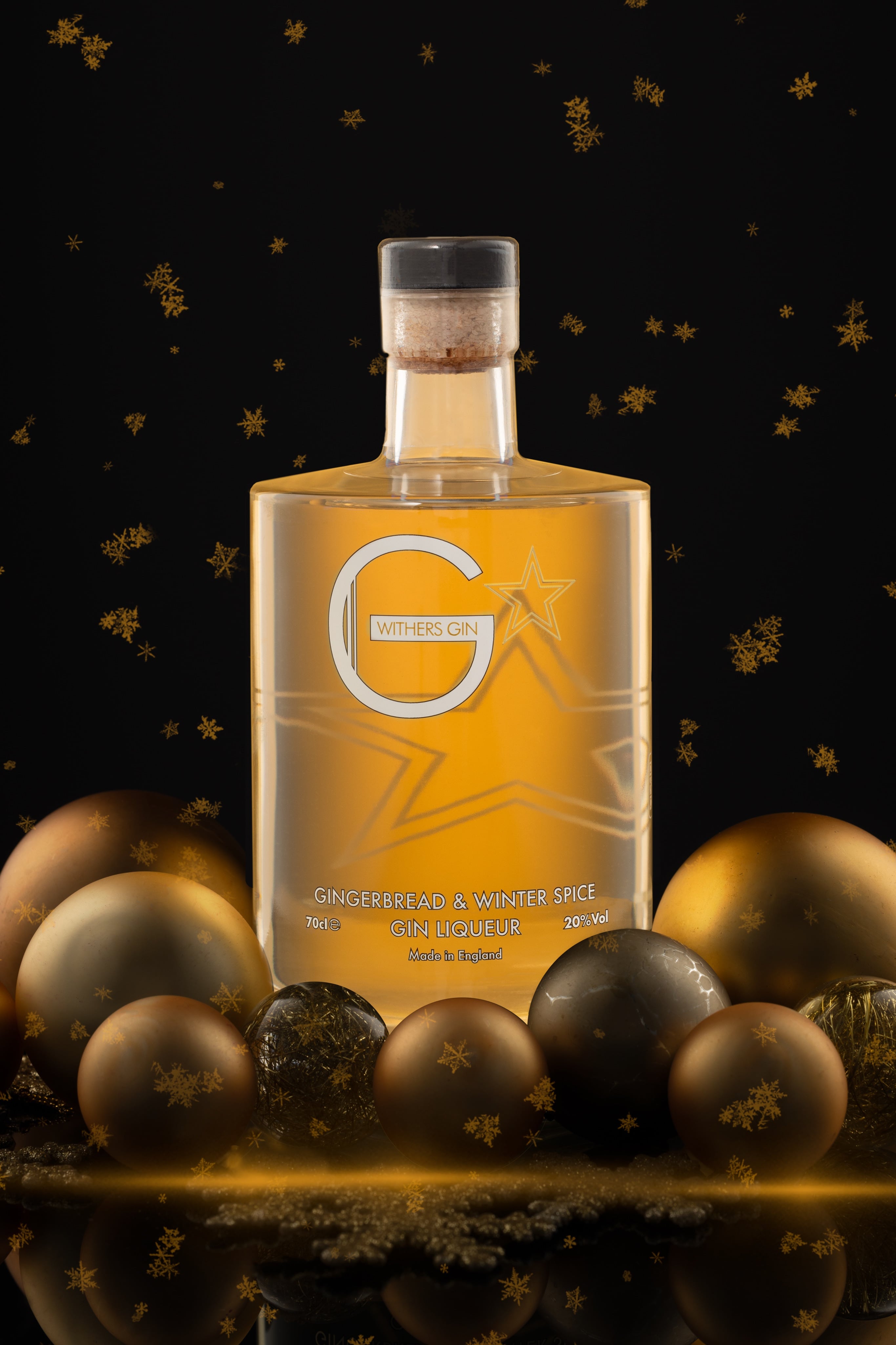 Creative photograph of a bottle of Withers Gin Gingerbread and Winter Spice Gin Liqueur, in a Christmas set. Christmas Drinks Photograph By JaxMore Food and Drink Photography, shot in their Derby studio.