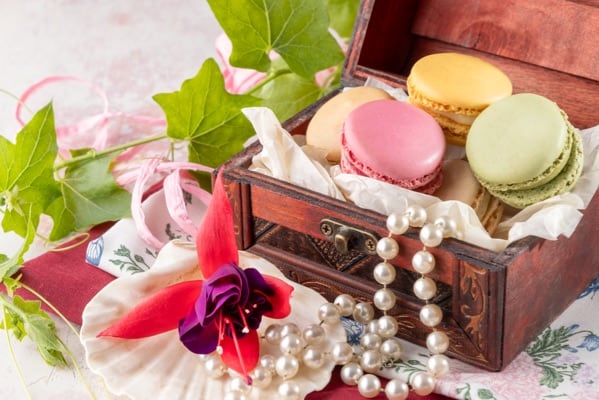 A chest of delicate macarons, in all their decadence. Photographed by JaxMore Food and Drink Photography, in their Derby studio.